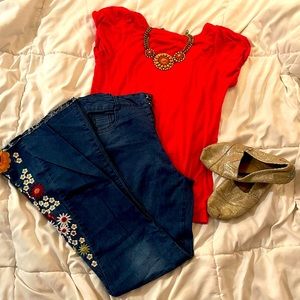 Flowered legs flared jeans